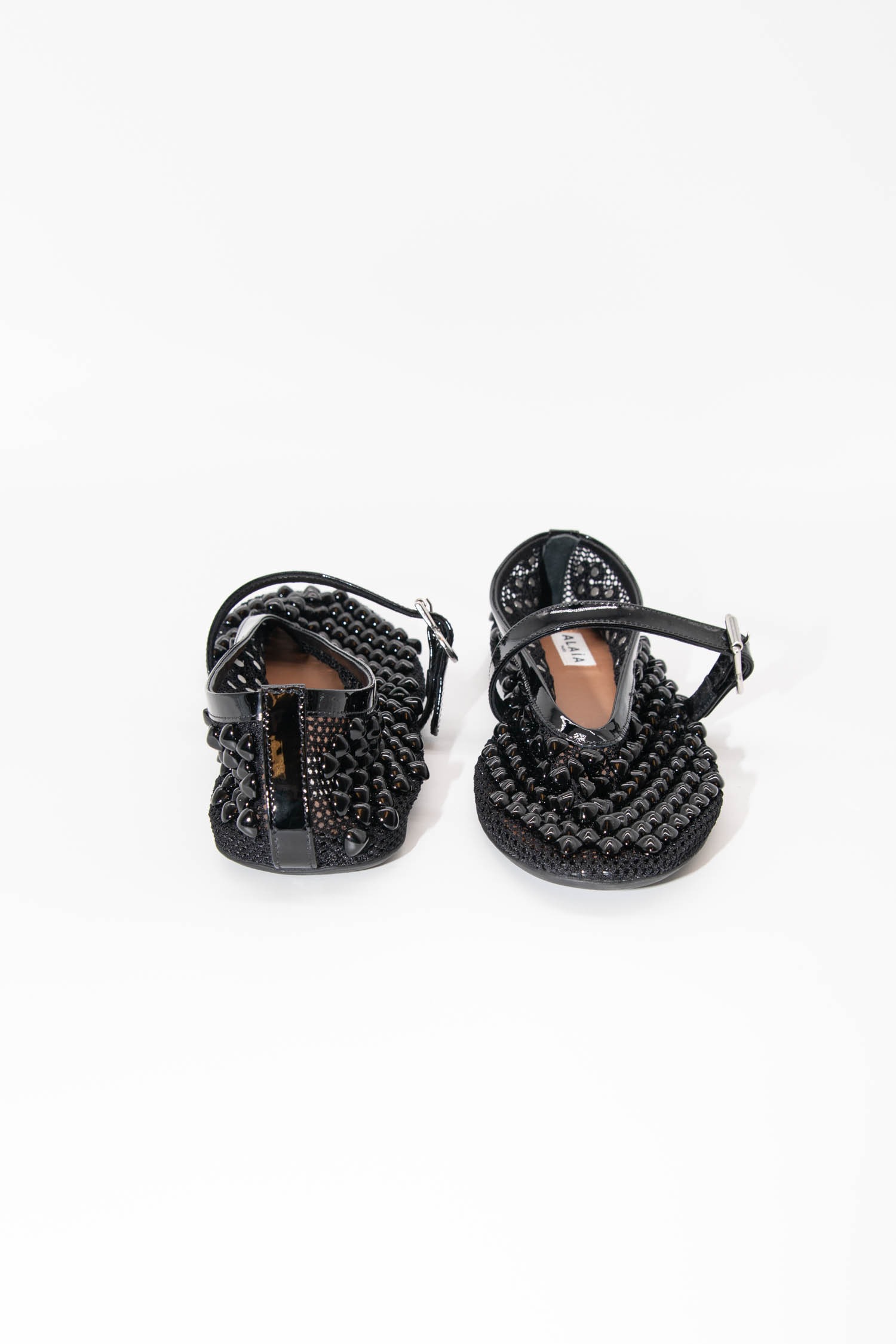 Alaïa Ballerinas mit Pyramidennieten in Schwarz