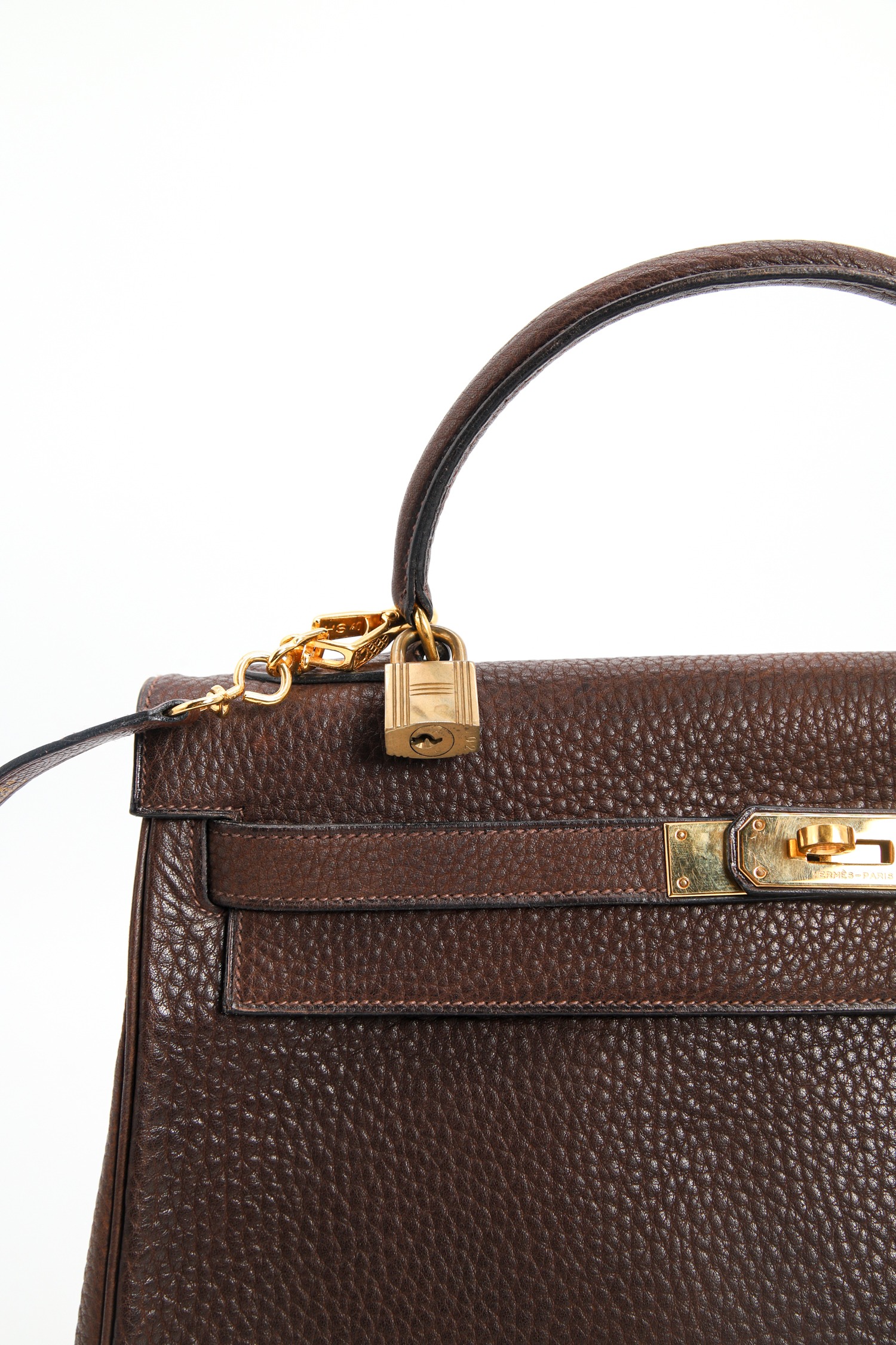 Hermès "Kelly Bag" in Dunkelbraun und Gold