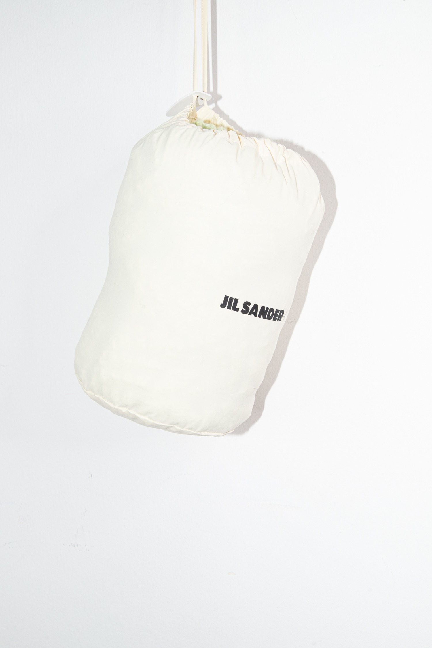 Jil Sander Oversized Daunenweste in Pastellgelb