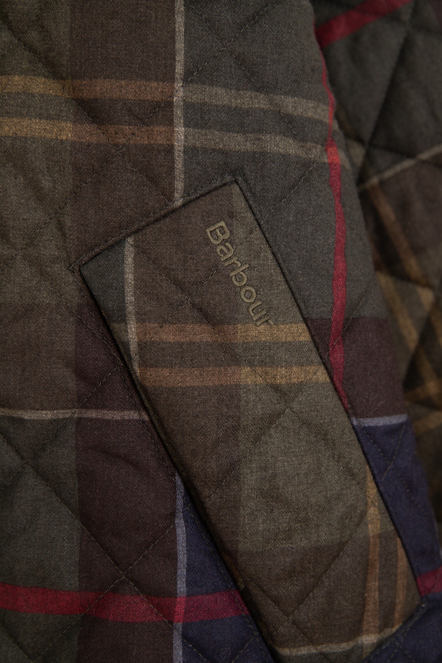 Barbour "Tartan Transport" Steppjacke in Dunkelgrün und Bunt