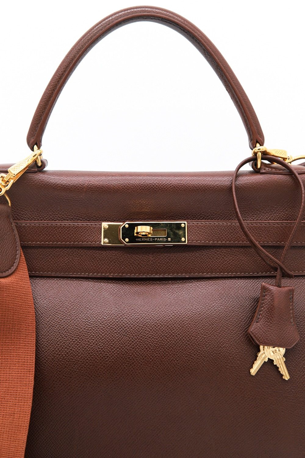 Thumbnail of http://Hermès%20Kelly%20Vintage%20Handtasche%20in%20Braun%20und%20Gold