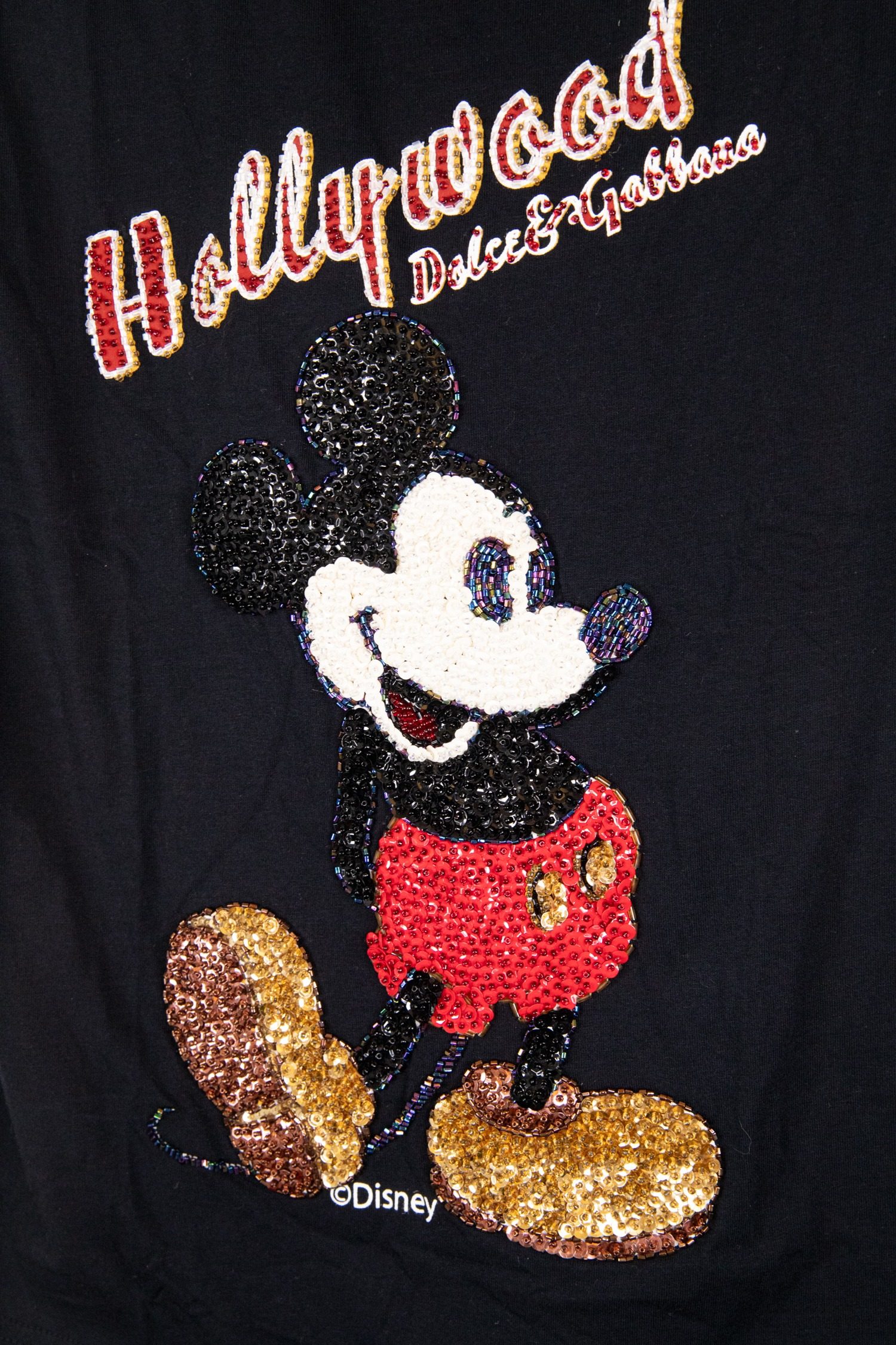 Thumbnail of http://Dolce%20&%20Gabbana%20Top%20mit%20Micky%20Maus%20und%20Pailletten%20in%20Schwarz
