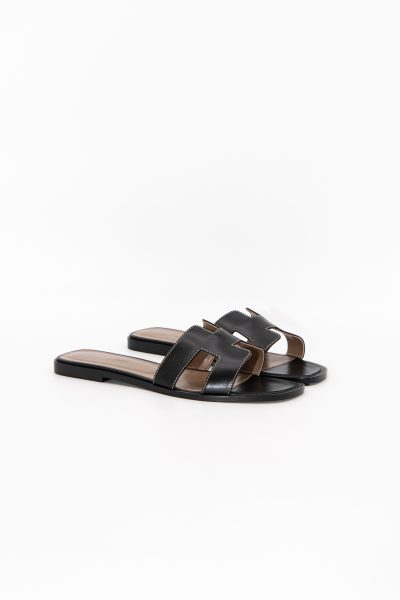 Hermès "Oran" Pantoletten in Schwarz