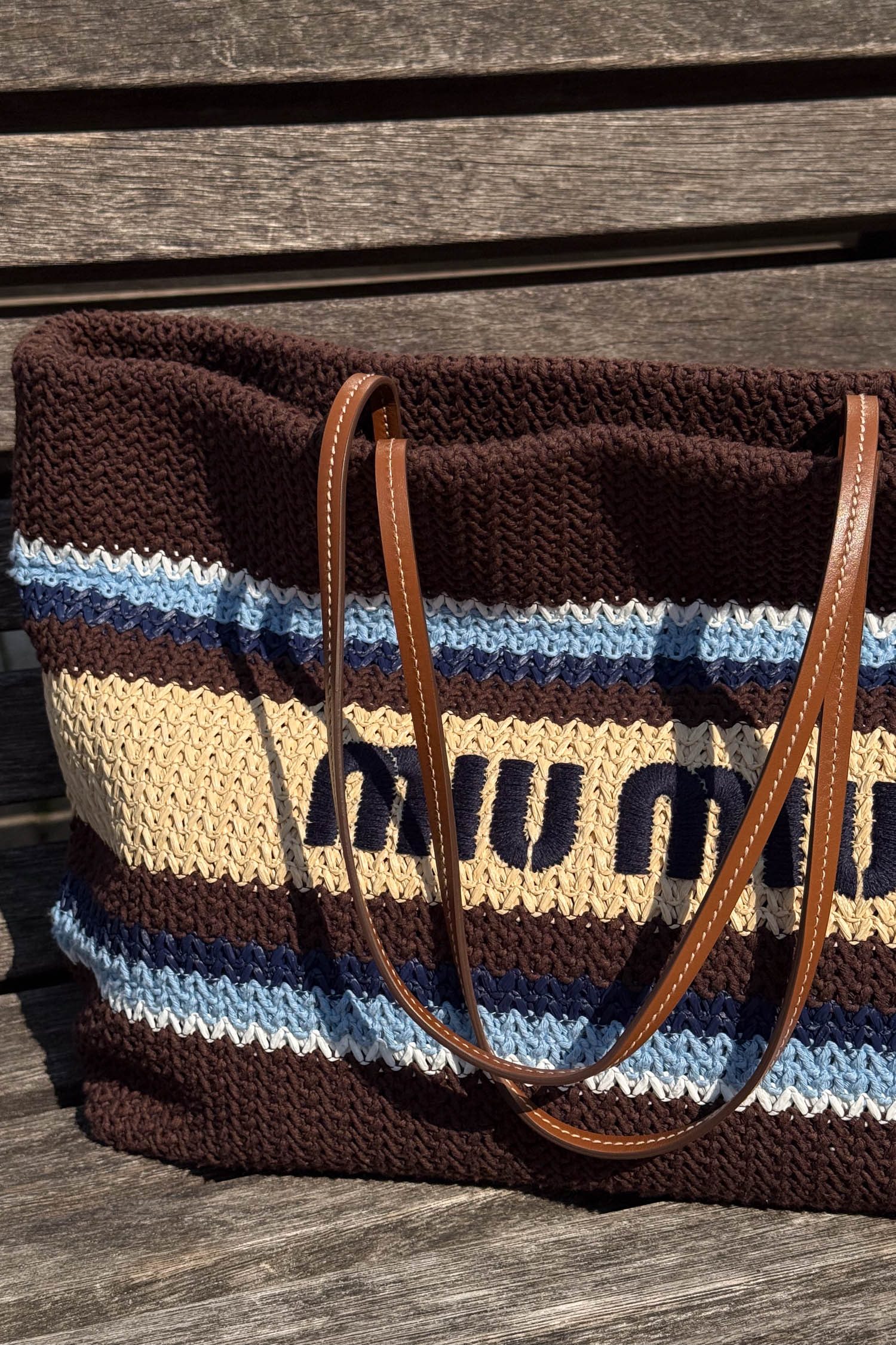Thumbnail of http://Miu%20Miu%20Raffia-effect%20woven%20tote%20bag