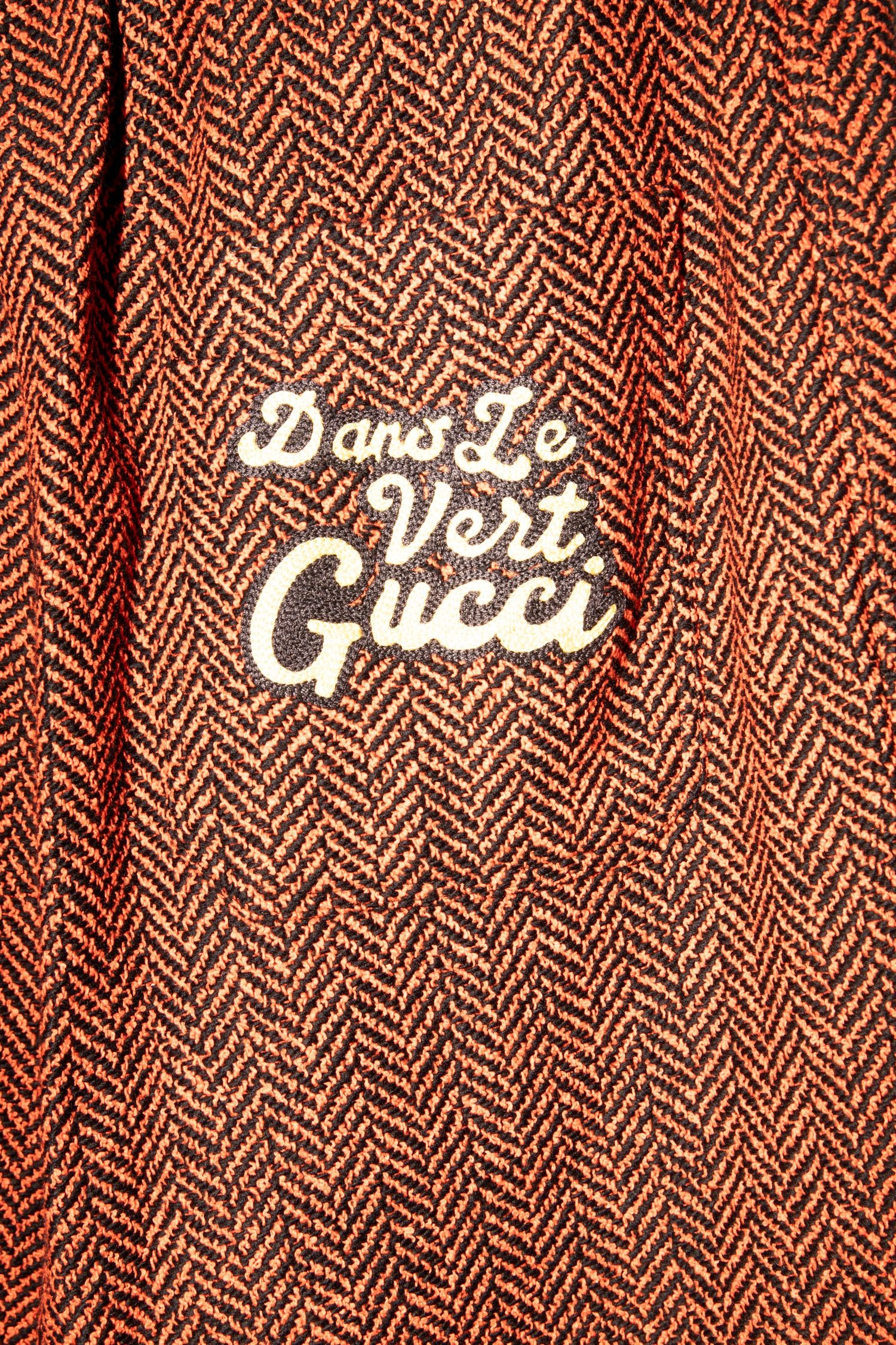 Thumbnail of http://Gucci%20Hose%20mit%20Fischgrätenmuster%20in%20Rot%20und%20Schwarz