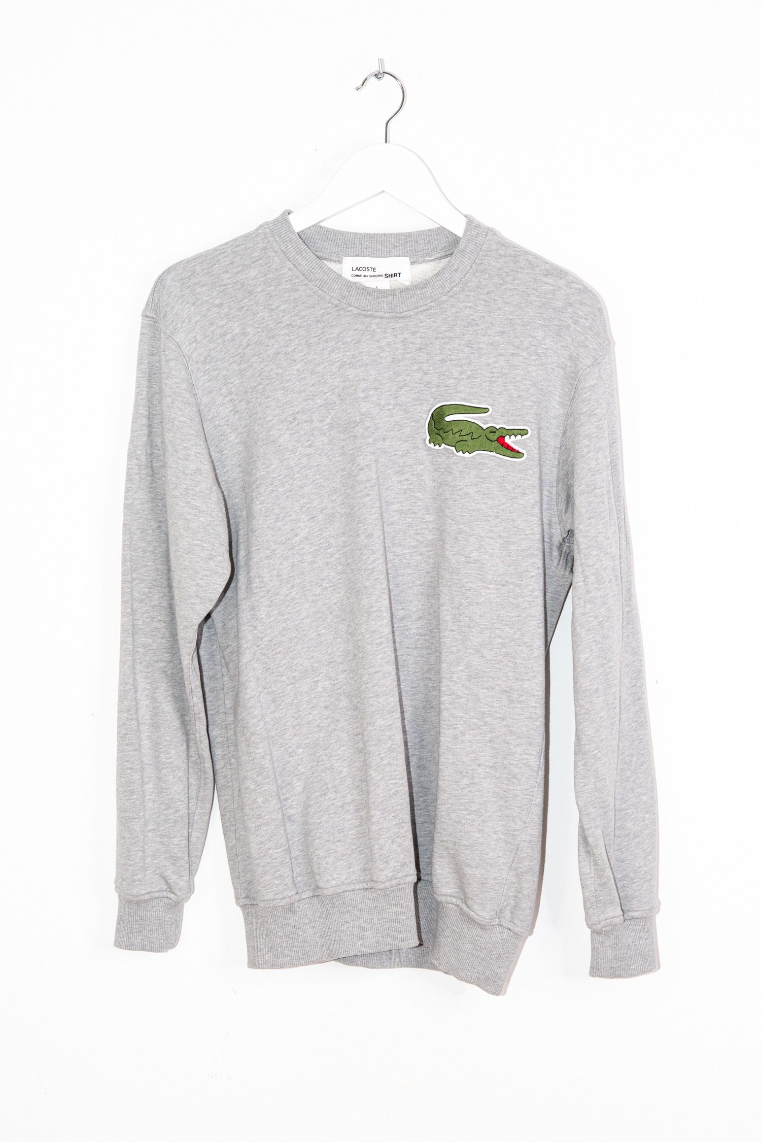 Thumbnail of http://Comme%20des%20Garçons%20x%20Lacoste%20Sweater%20in%20Hellgrau