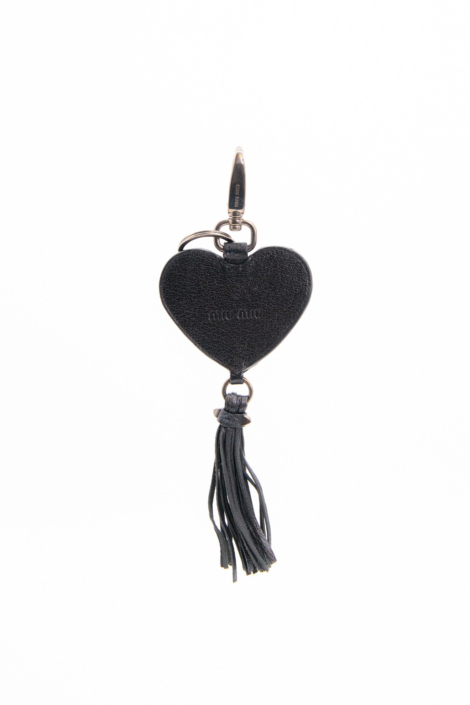 Thumbnail of http://Miu%20Miu%20Herzförmiger%20Taschenanhänger%20in%20Schwarz%20und%20Silber