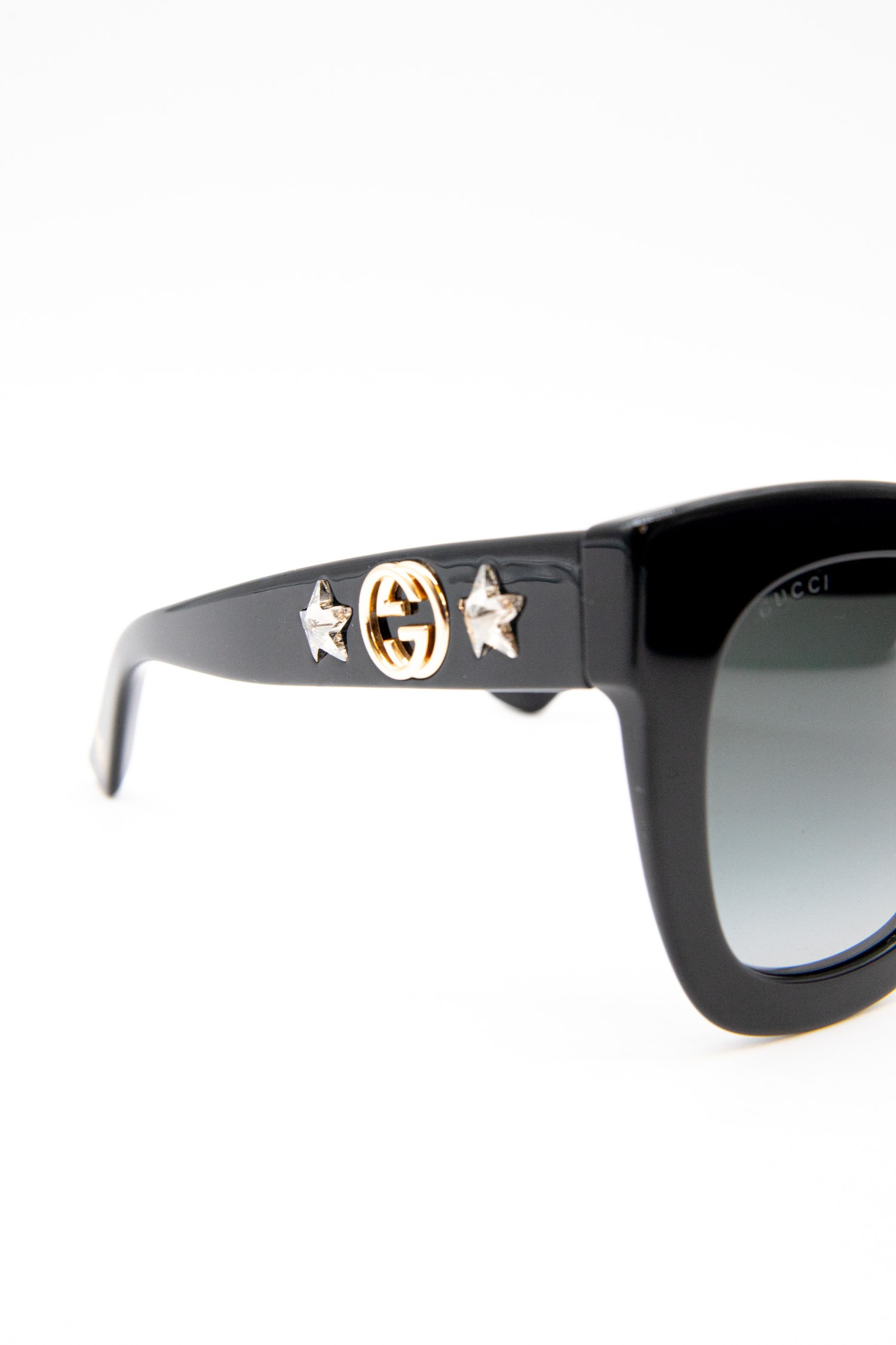 Gucci Sonnenbrille mit Strasssternen in Schwarz